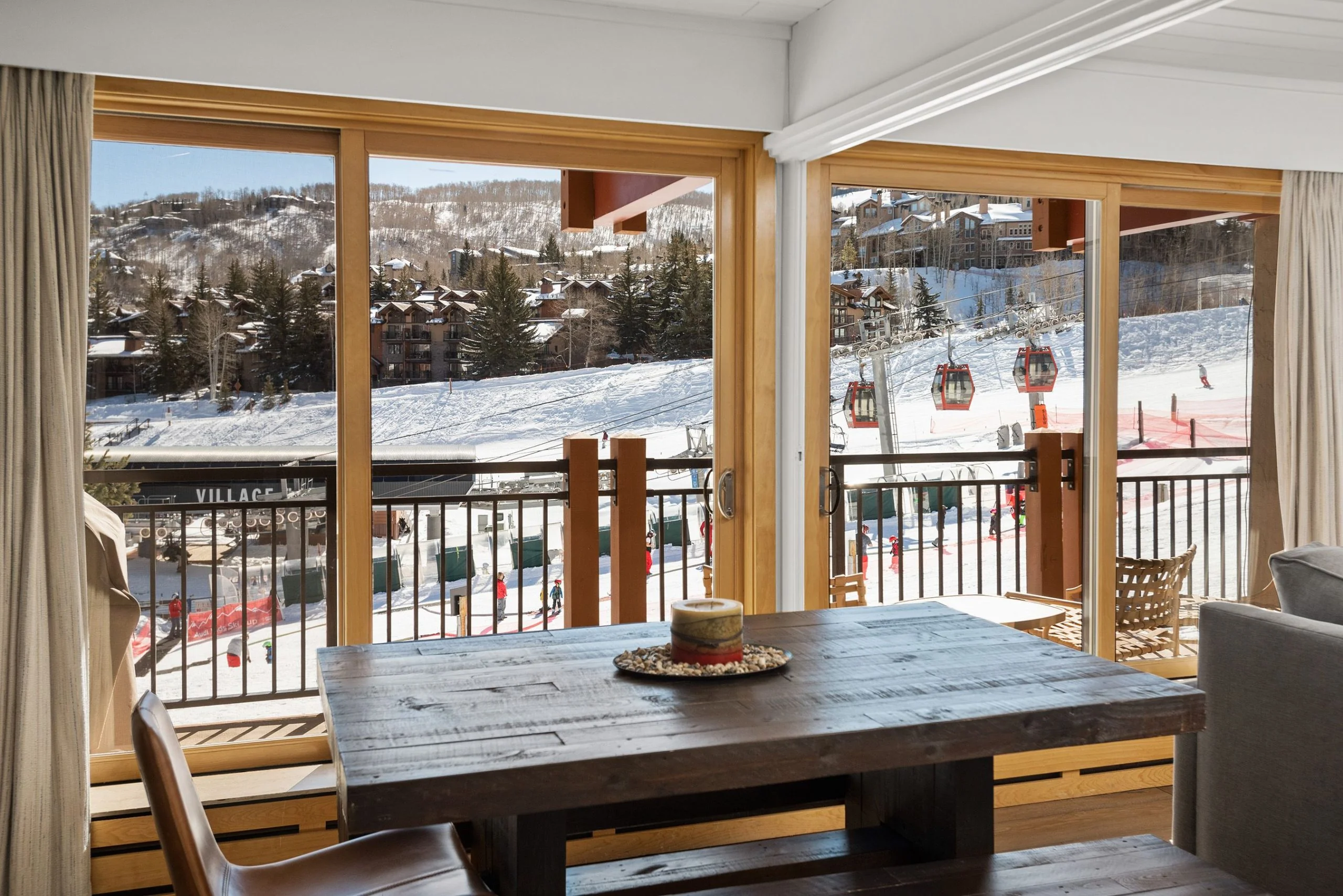 View from a Stonebridge condo dining room across Snowmass slopes toward Base Village and the gondola