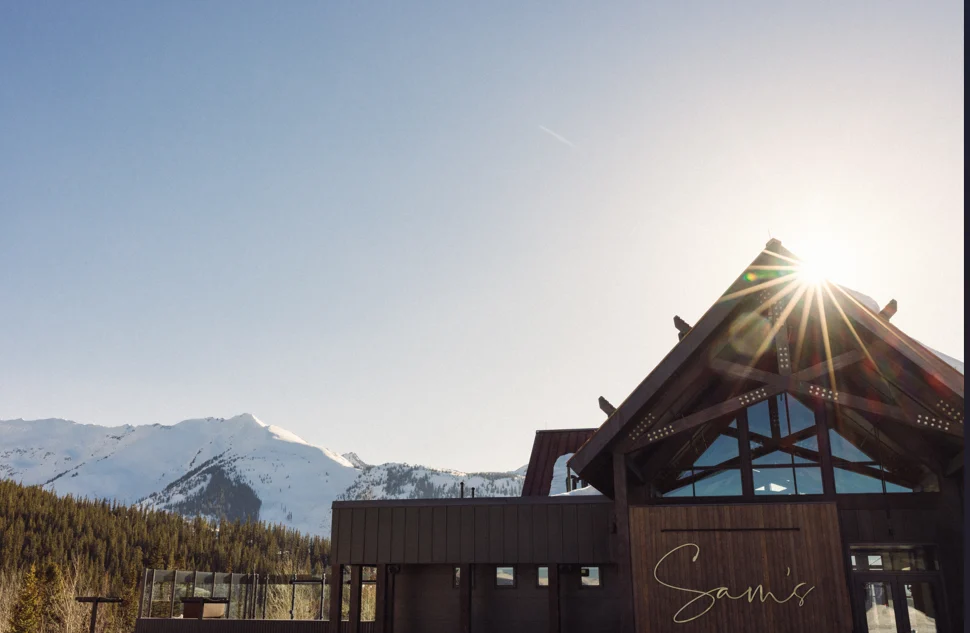 Sam's Smokehouse deck at the top of Sam's Knob — the classic mid-mountain après scene at Snowmass